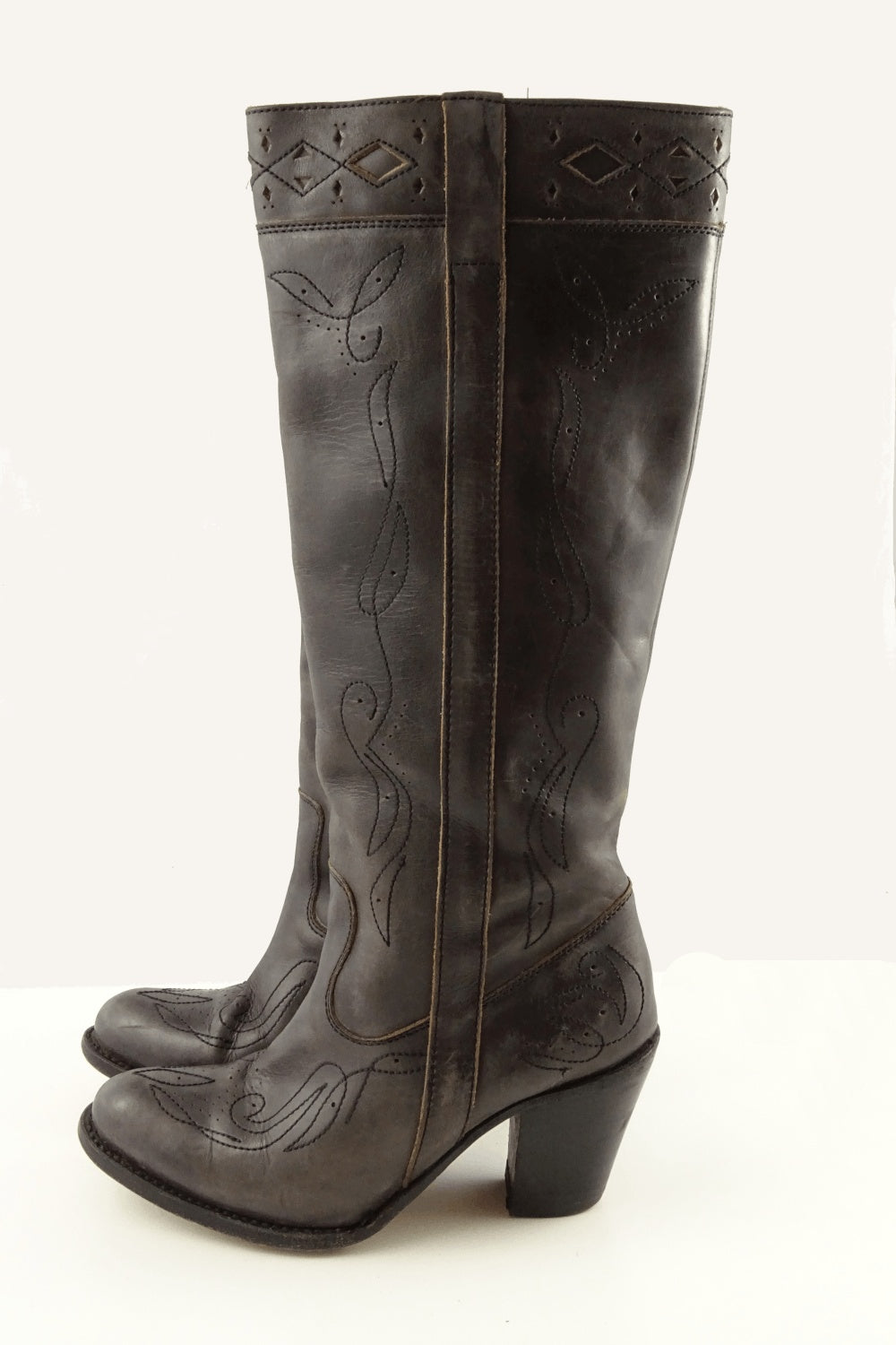 Sancho knee high boots with stitch detail. Has elastic wedge at tope of boot. Genuine leather. Made in Spain.