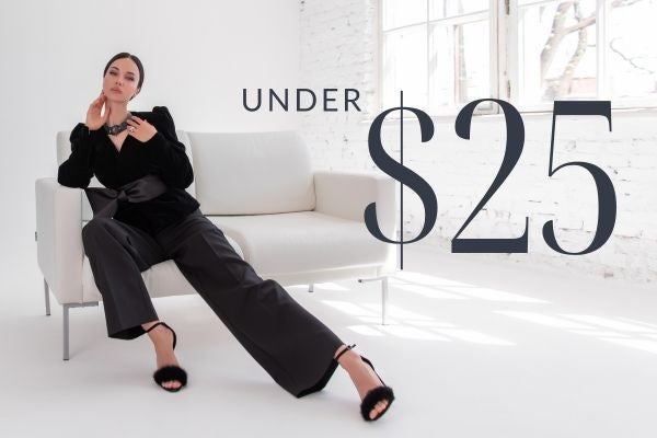 Woman wearing black outfit sitting on white couch Under $25 items